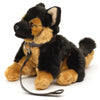 Plush German Shepherd dog toy with a leash on a white background
